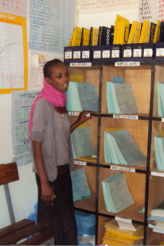 Health working in Ethiopia uses the Family Folder system to track health services. Photo by MEASURE Evaluation.